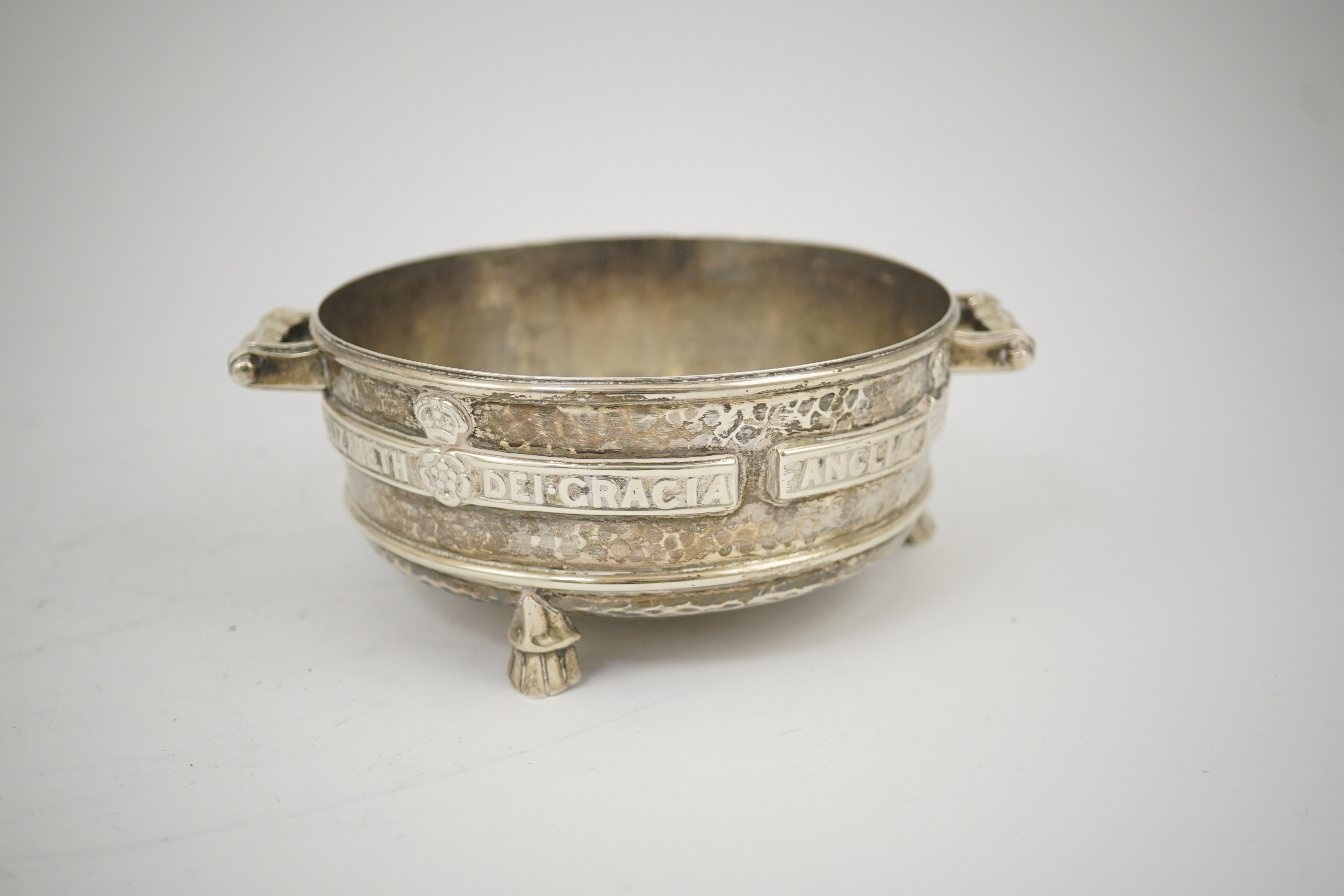 A George V Arts & Crafts planished silver replica of a late 15th century Winchester Bushel measure, by Albert Edward Jones